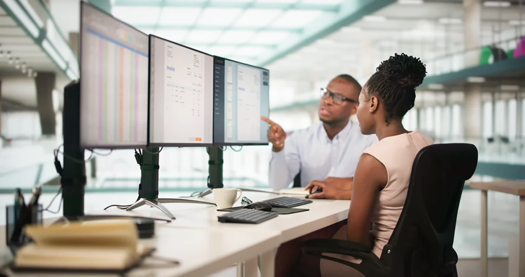 Technician reviewing aviation maintenance data and dashboards for operational decisions.